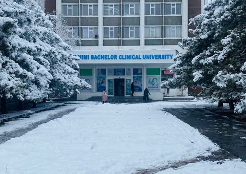 Building of Altamimi International University (signed Altamimi Bachelor Clinical University) in winter, Bishkek